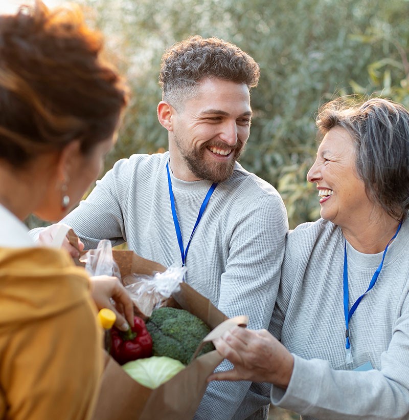 volunteers handing out groceries